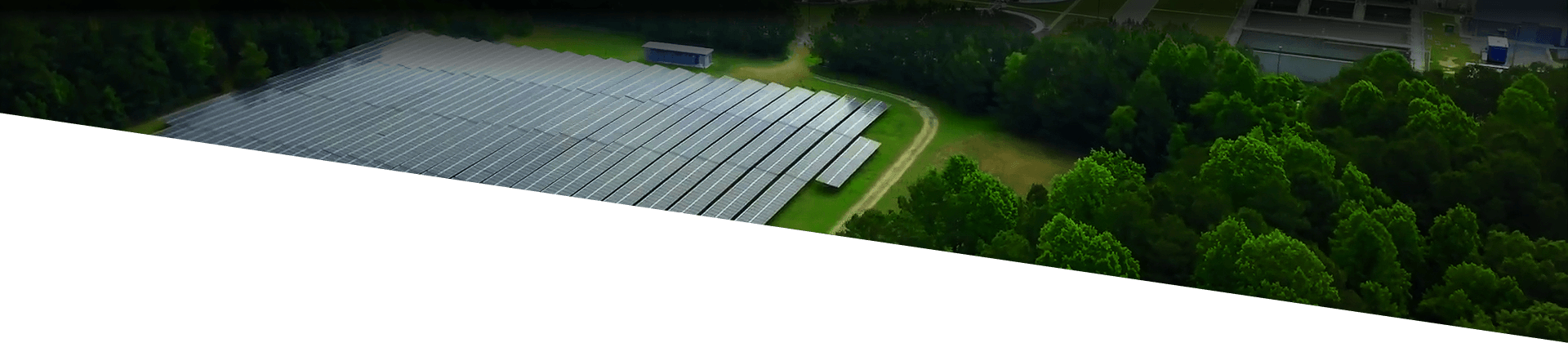Cary NC's Open Data Portal; Background image of a solar array surrounded by trees.